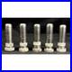 Antique-Very-Rare-Set-of-5-New-SCM-Company-Brass-Nickel-Tire-Valve-Stem-Covers-01-oxs