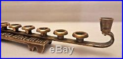 VERY RARE! An old vintage menorah from brass. On one side is a Star of David