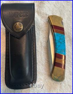 Very Rare Buck 110, Inverted U, Turquoise and Wood Inlay and Brass Custom Knife