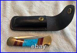 Very Rare Buck 110, Inverted U, Turquoise and Wood Inlay and Brass Custom Knife