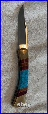 Very Rare Buck 110, Inverted U, Turquoise and Wood Inlay and Brass Custom Knife