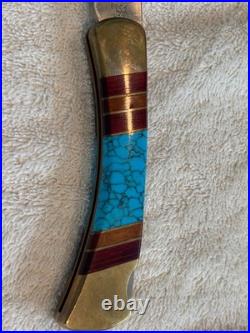 Very Rare Buck 110, Inverted U, Turquoise and Wood Inlay and Brass Custom Knife