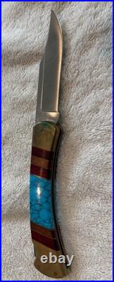 Very Rare Buck 110, Inverted U, Turquoise and Wood Inlay and Brass Custom Knife