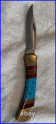 Very Rare Buck 110, Inverted U, Turquoise and Wood Inlay and Brass Custom Knife